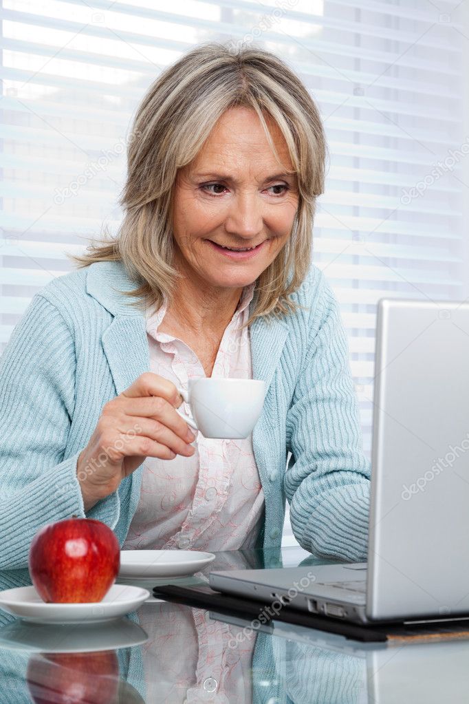 Depositphotos 7945119 Stock Photo Woman Working On Laptop While